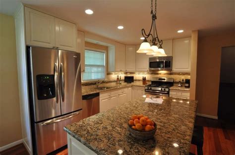 giallo fiorito granite kitchen stainless steel appliances and brown cabinets|giallo fiorito countertops reviews.